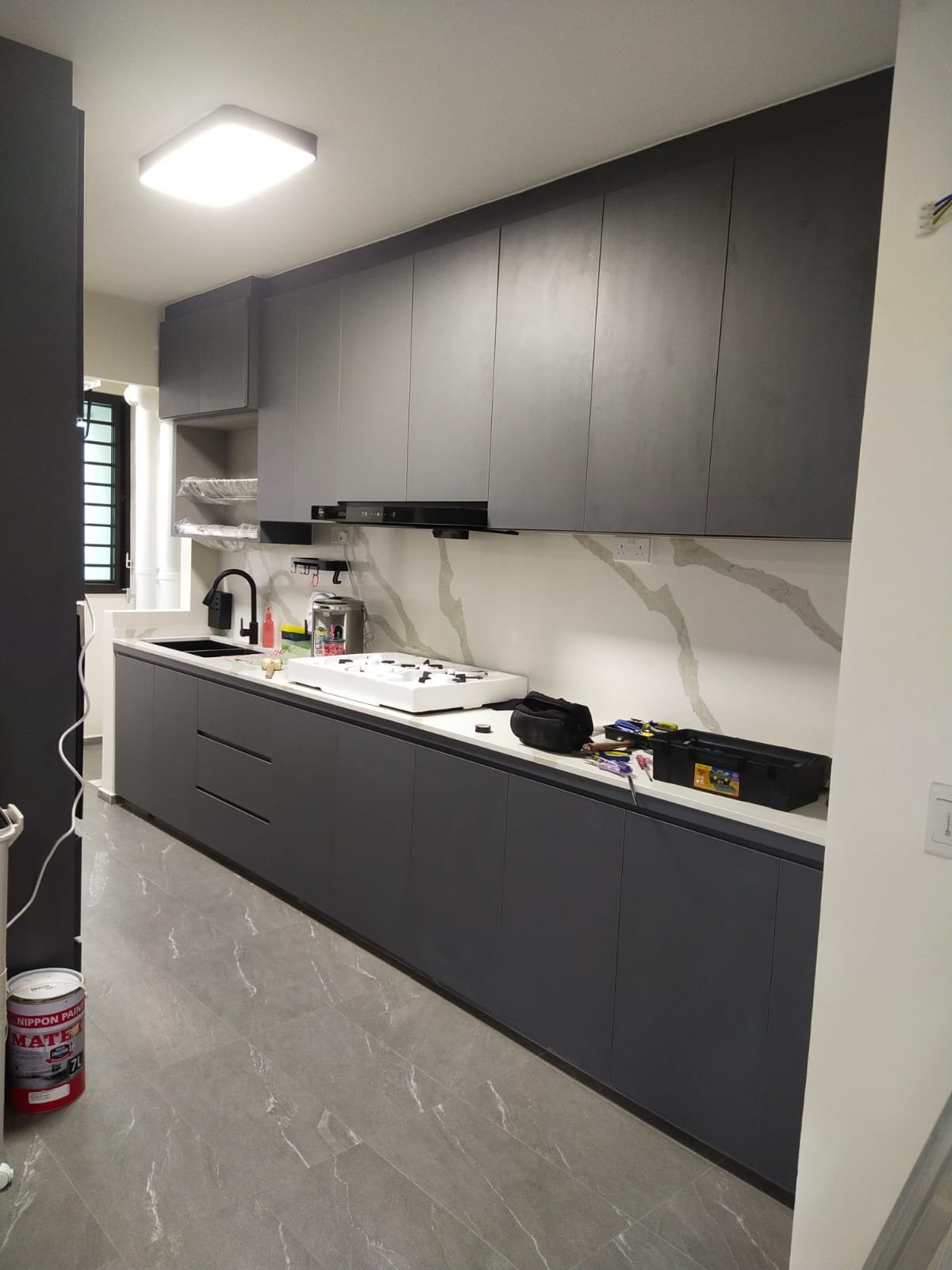 HDB kitchen with stone-look floor tiles