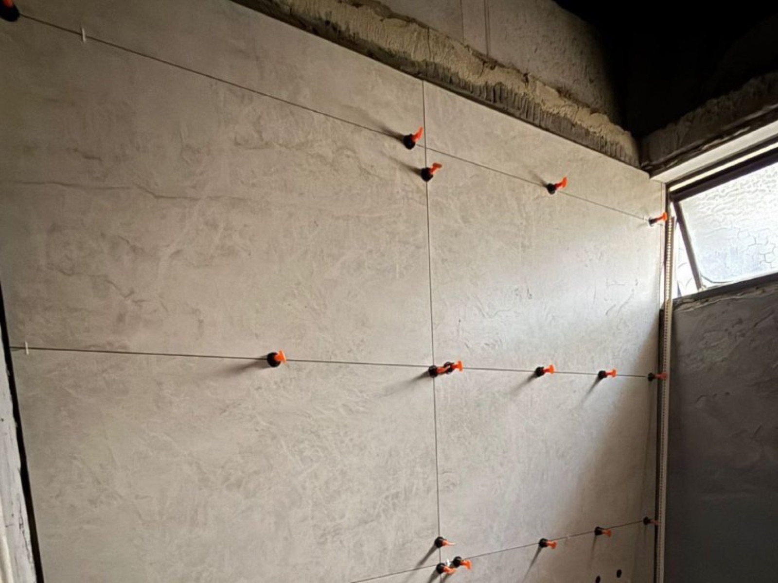 Large-format wall tiling near a window