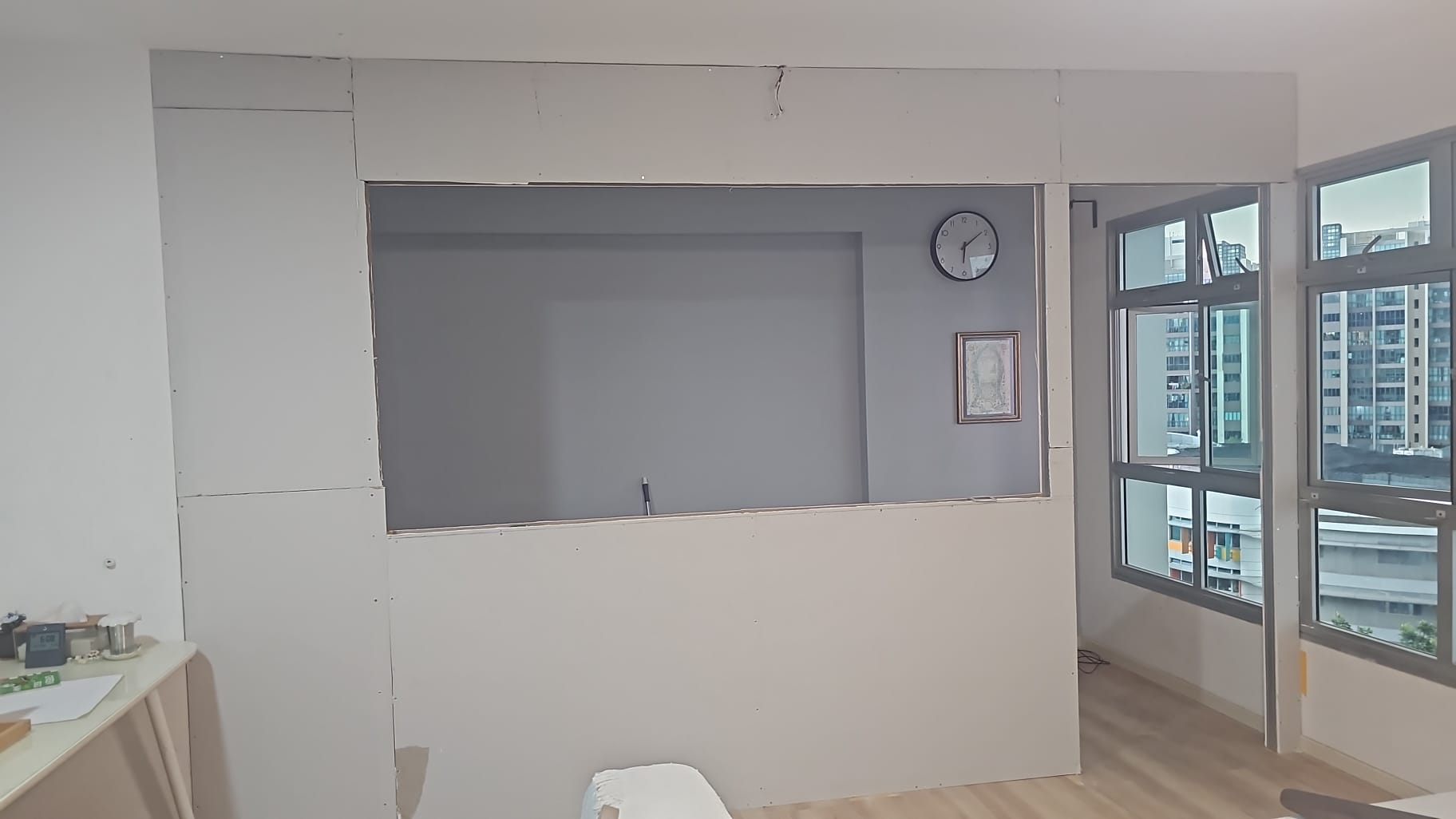Drywall partition framed and boarded on site, before the glass panels are installed